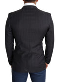 Manteau en laine noir Dolce & Gabbana, blazer à un seul bouton et coupe classique, porté sur un mannequin.