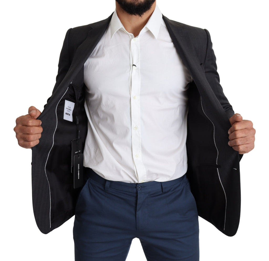 Manteau noir en laine Dolce & Gabbana, blazer à un bouton, coupe classique, porté sur un fond neutre.