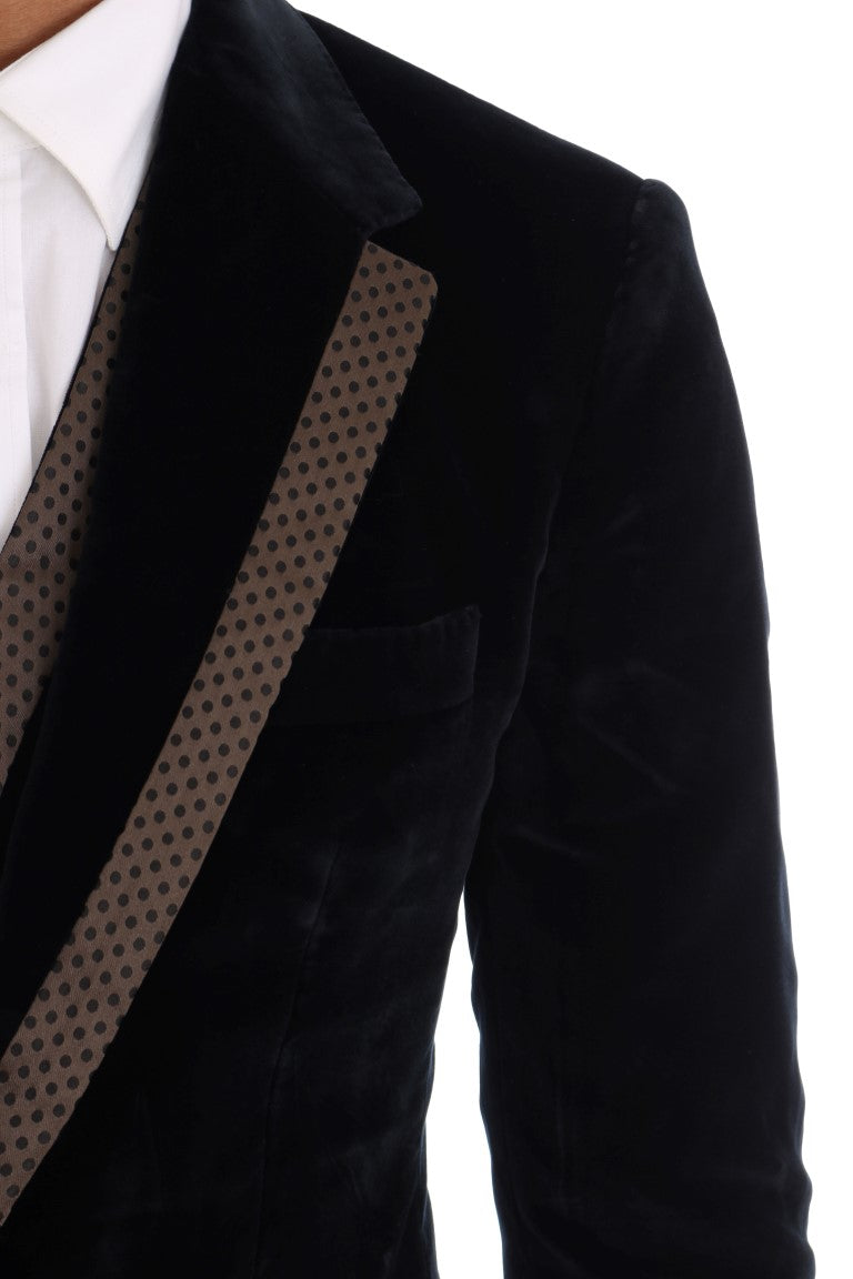 Costume deux pièces Dolce & Gabbana en velours bleu, veste à deux boutons et pantalon slim, élégant et sophistiqué.