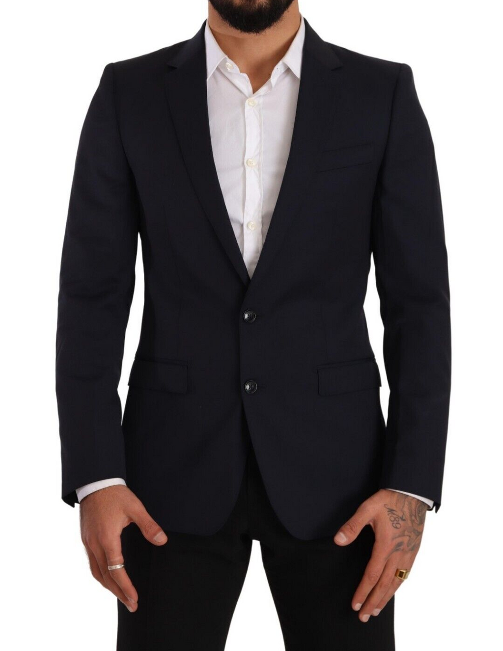 Manteau bleu foncé Dolce & Gabbana, blazer Martini à un seul bouton, coupe élégante et classique, porté sur un mannequin.