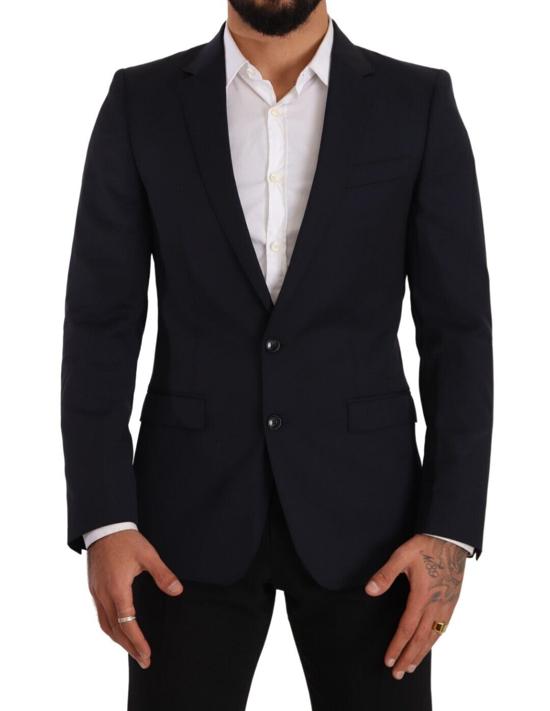 Manteau bleu foncé Dolce & Gabbana, blazer Martini à un seul bouton, coupe élégante et classique, porté sur un mannequin.