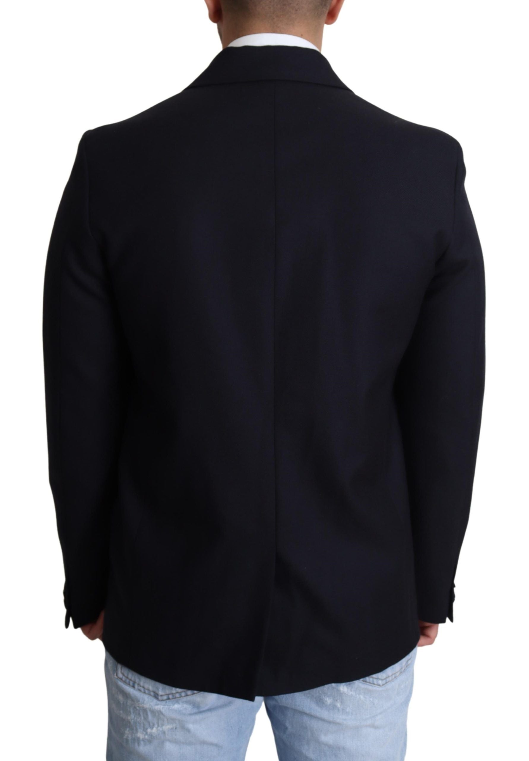 Manteau en laine bleu foncé Dolce & Gabbana à un seul bouton, coupe classique et élégante, porté sur un mannequin.