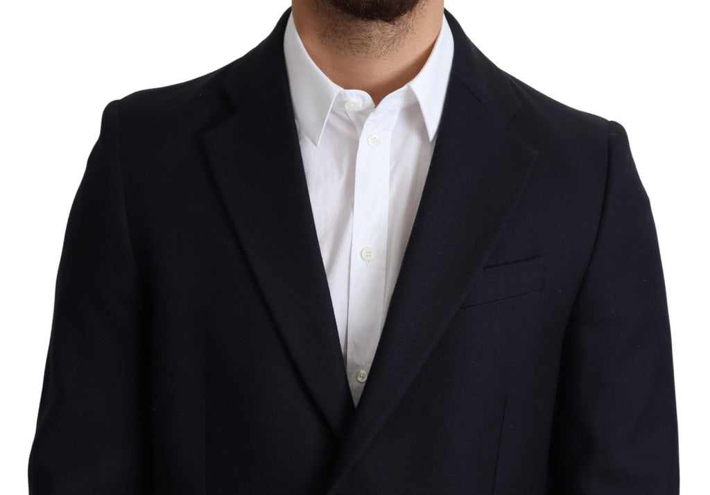 Manteau en laine bleu foncé Dolce & Gabbana à simple boutonnage, élégant et chaud, porté sur un mannequin.