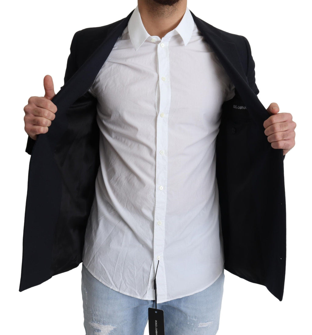 Manteau en laine bleu foncé à un seul bouton de Dolce & Gabbana, coupe classique, porté sur un mannequin.