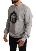 Pull en coton gris avec impression couronne King Dolce & Gabbana, détail de la texture et du motif sur le devant.