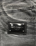 Jean droit gris délavé à taille moyenne Dolce & Gabbana, look décontracté avec détails en denim.