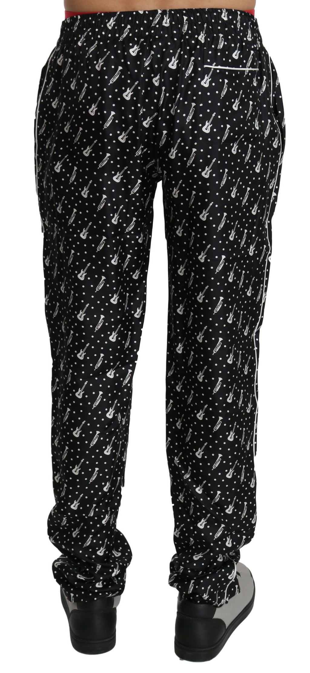 Pantalons noirs en soie Dolce & Gabbana avec motif d'instrument de musique, élégants et sophistiqués pour femmes.