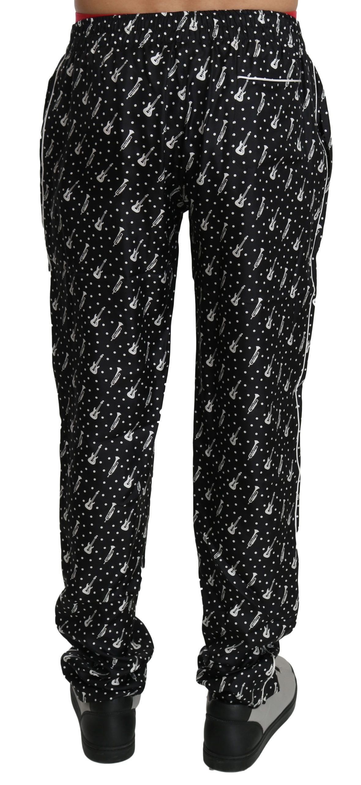 Pantalons noirs en soie Dolce & Gabbana avec motif d'instrument de musique, élégants et sophistiqués pour femmes.