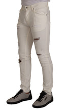 Jeans slim déchirés en coton blanc de Dolce & Gabbana pour homme, coupe skinny et style décontracté.
