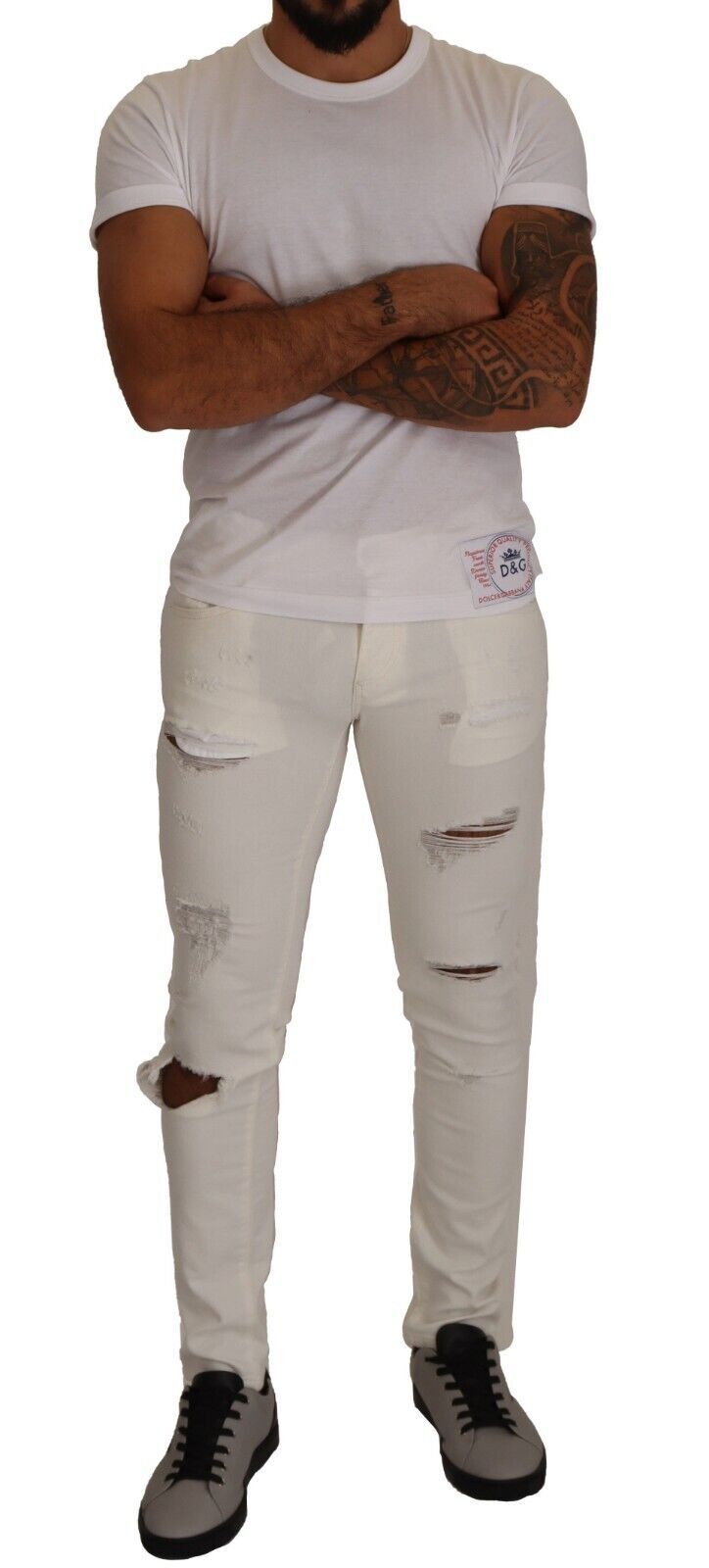 Jeans hommes Dolce & Gabbana en coton blanc déchiré, coupe skinny, style tattered, denim élégant et tendance.
