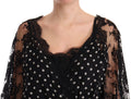 Robe longue noire en dentelle florale à pois de Dolce & Gabbana, style maxi et Capri, avec détails élégants et tissu délicat.
