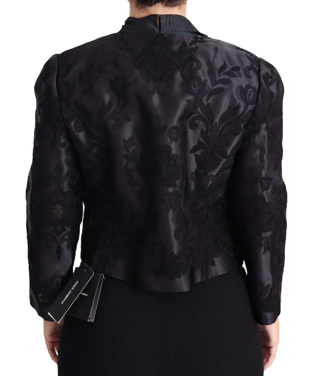 Veste en soie et organza noire Dolce & Gabbana avec corset en dentelle transparente et détails élégants.