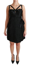 Robe courte en satin jacquard noir de Dolce & Gabbana, stretch et élégante, pour une silhouette sophistiquée.