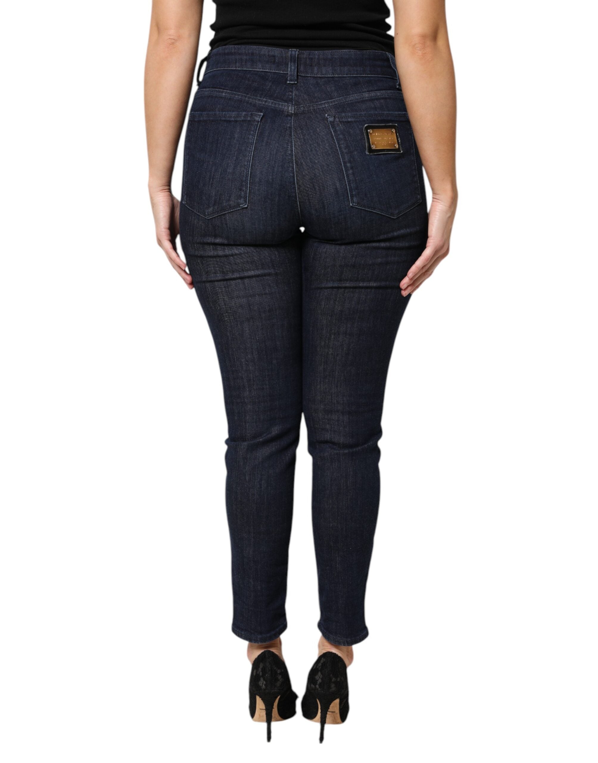 Jeans slim cropped en denim coton bleu foncé de Dolce & Gabbana, coupe ajustée et moderne, visible sur l’image.