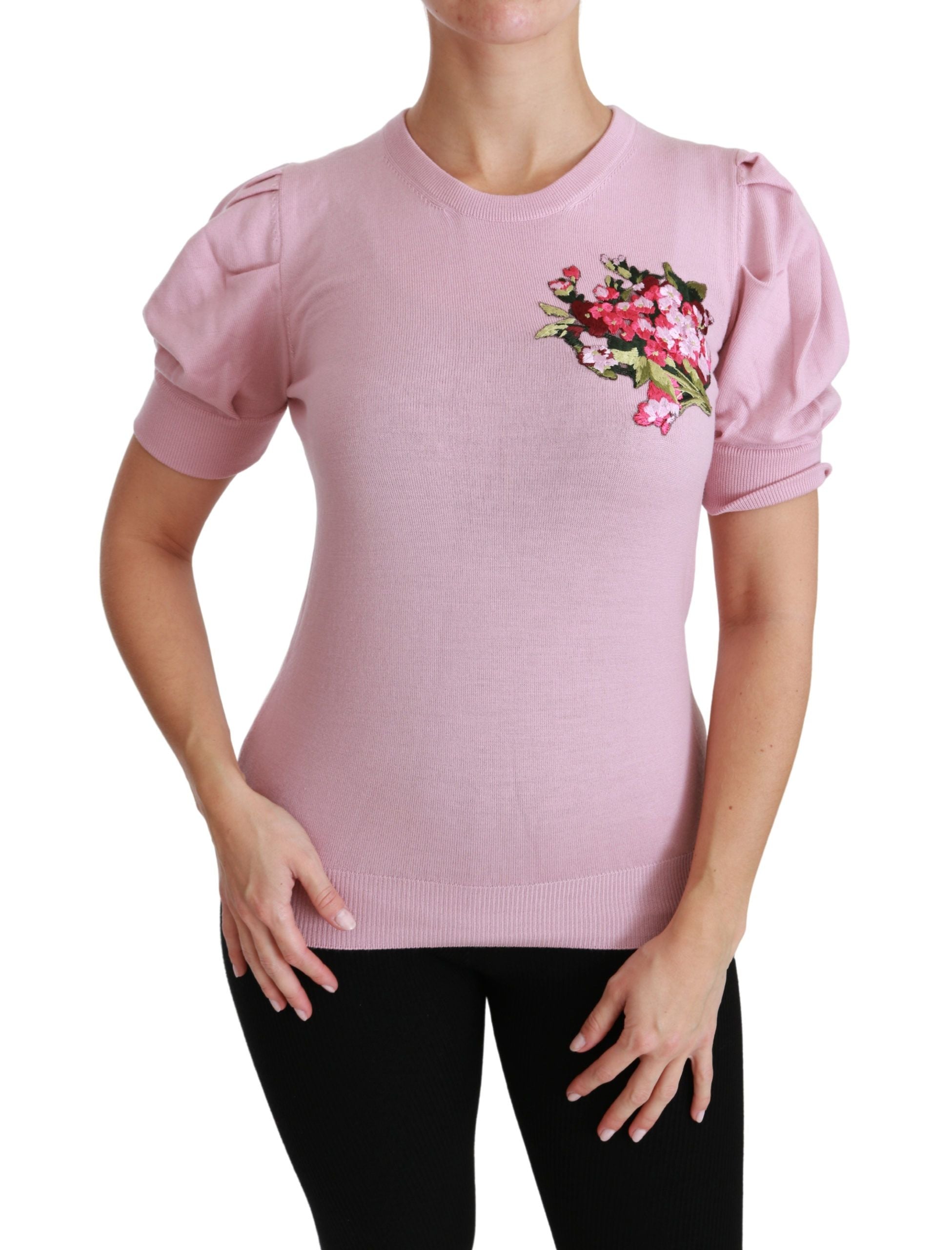 Blouse en laine rose Dolce & Gabbana avec broderie florale élégante et détails raffinés pour un look sophistiqué.
