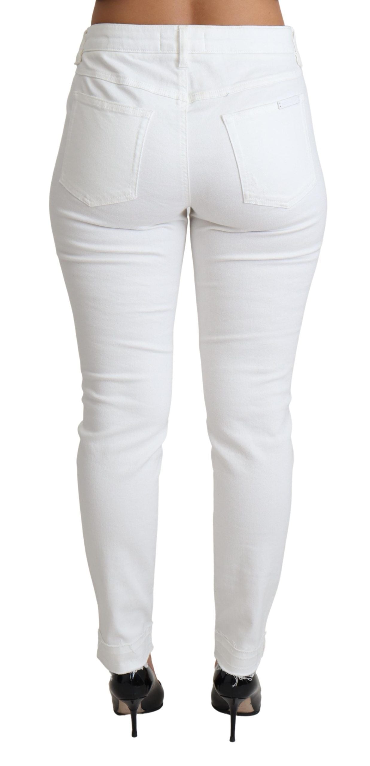 Jeans skinny en denim blanc tattered de Dolce & Gabbana, coupe ajustée, en coton stretch avec déchirures à l'aspect décontracté.