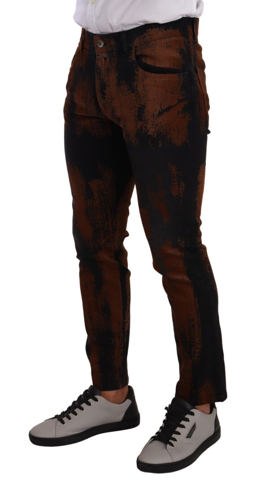 Jeans skinny en coton tie-dye noir et marron de Dolce & Gabbana, denim avec effet délavé et détails modernes.