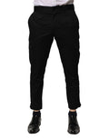 Pantalon formel noir en coton de Dolce & Gabbana, coupe slim pour femme, vue de devant sur mannequin.