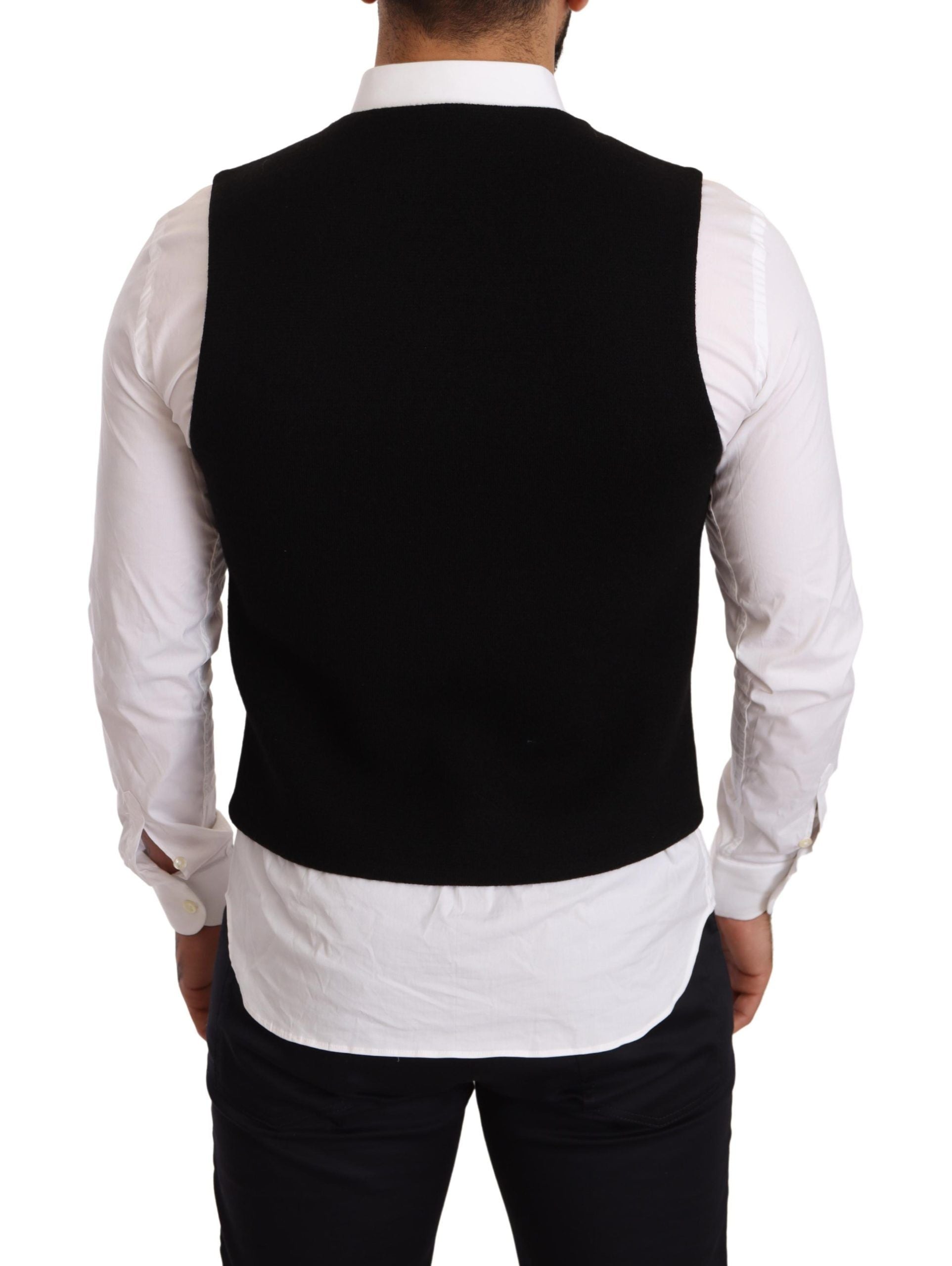 Gilet noir en coton Dolce & Gabbana à boutonnière simple, détail élégant et couture sophistiquée.