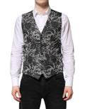 Gilet homme formel Dolce & Gabbana en brocart noir et gris, élégant et sophistiqué, avec fermeture à boutons.