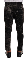 Jeans slim noir à motifs Dolce & Gabbana, coupe skinny et ajustée, en denim élégant avec détails graphiques.