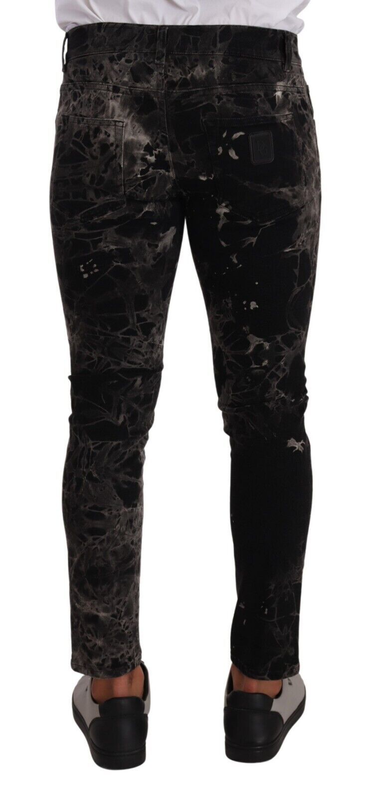 Jeans slim noir à motifs Dolce & Gabbana, coupe skinny et ajustée, en denim élégant avec détails graphiques.