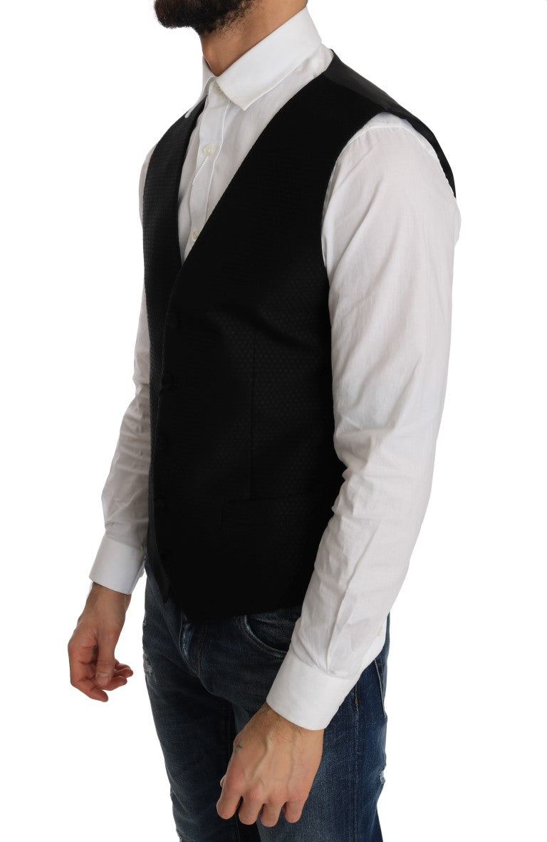 Gilet noir à pois à motif Dolce & Gabbana, design élégant avec détails en tissu noir et pois blancs.