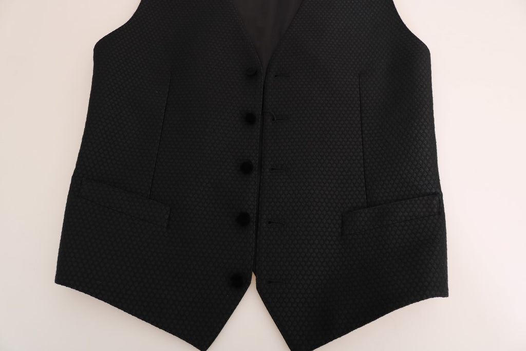 Gilet noir à pois Dolce & Gabbana avec motif à pois noirs et blancs, en tissu élégant, pour un style sophistiqué.