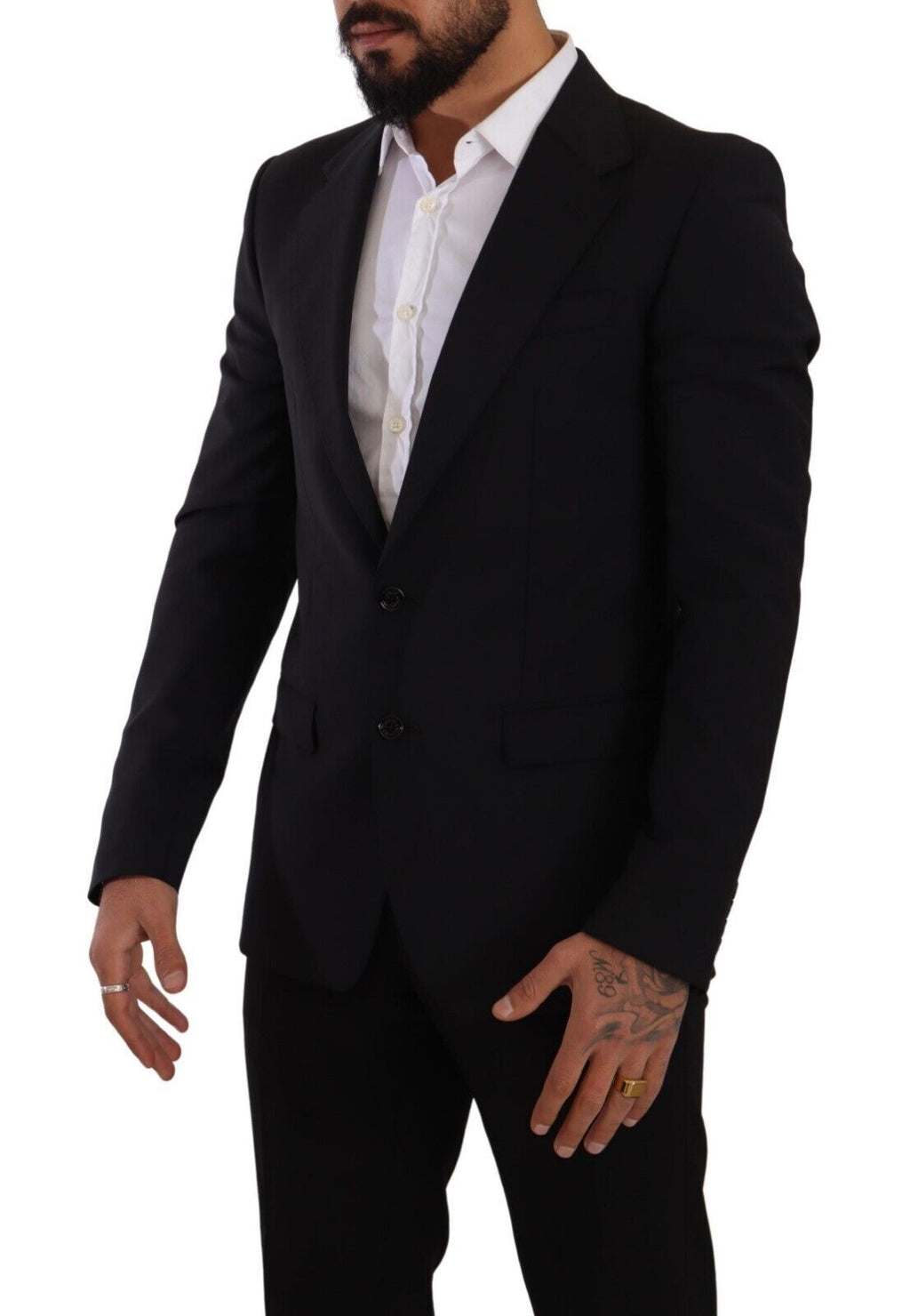 Gilet noir Dolce & Gabbana ajusté à deux boutons, style Martini blazer, porté sur un mannequin dans une image élégante.