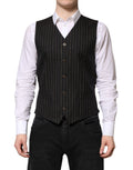 Gilet formel pour homme Dolce & Gabbana en laine noire avec rayures, élégant et ajusté, porté sur une chemise blanche.