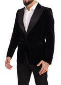 Blazer noir en velours à un bouton de Dolce & Gabbana, coupe élégante, porté sur un mannequin.
