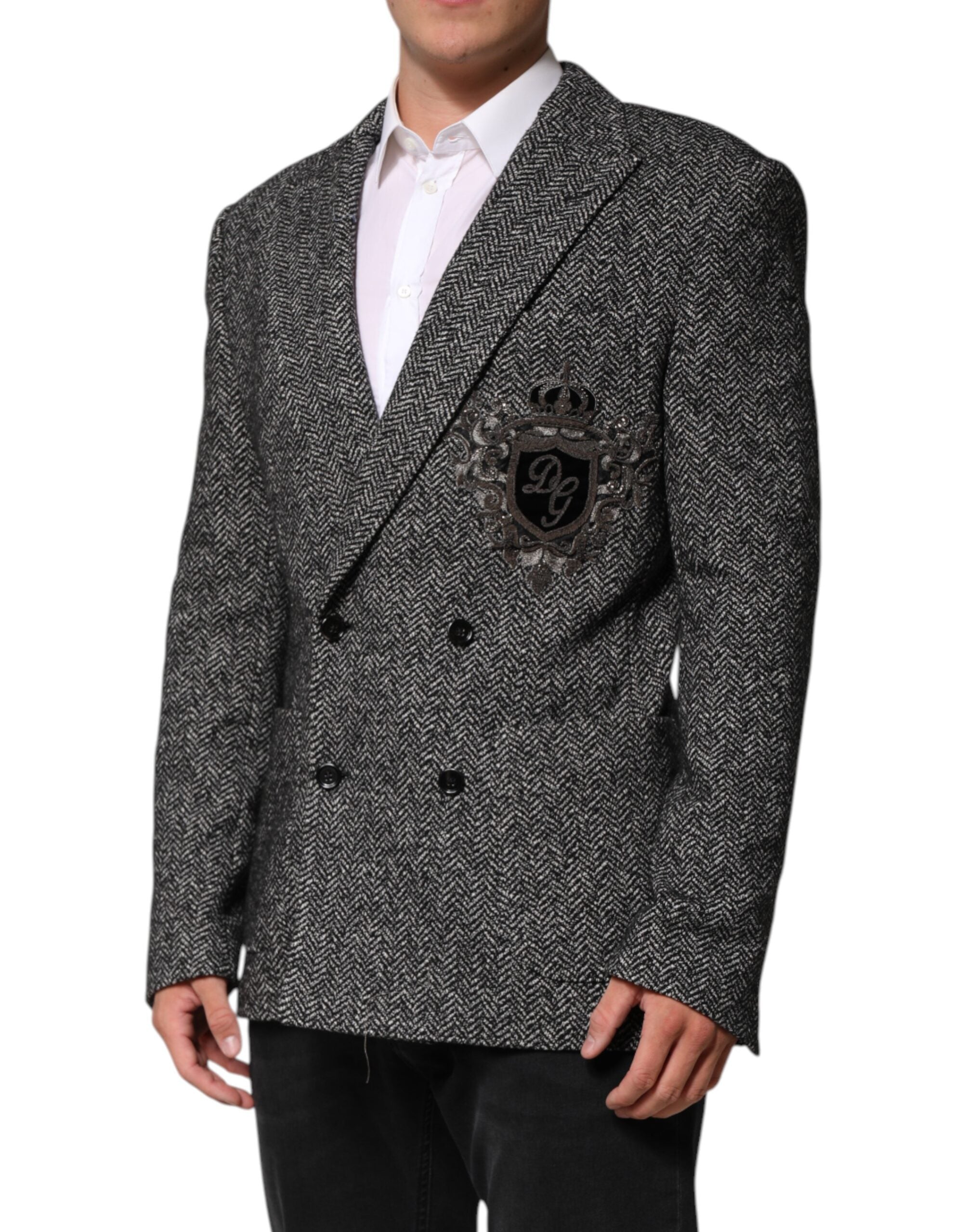 Costume pour homme Dolce & Gabbana noir et blanc, blazer à double boutonnage avec col en pointe, élégant et sophistiqué.