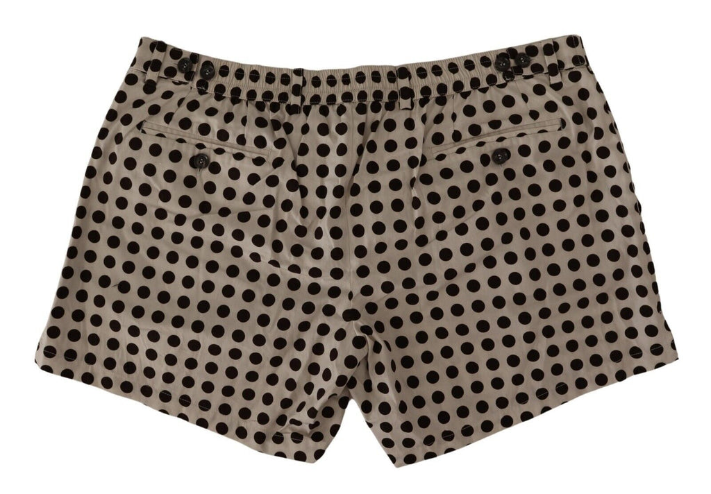 Shorts en coton et lin à pois noirs et blancs de Dolce & Gabbana, style décontracté et élégant.