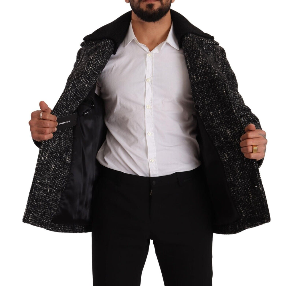 Manteau homme Dolce & Gabbana en laine noire à double boutonnage, style élégant et classique, visible sur le mannequin.