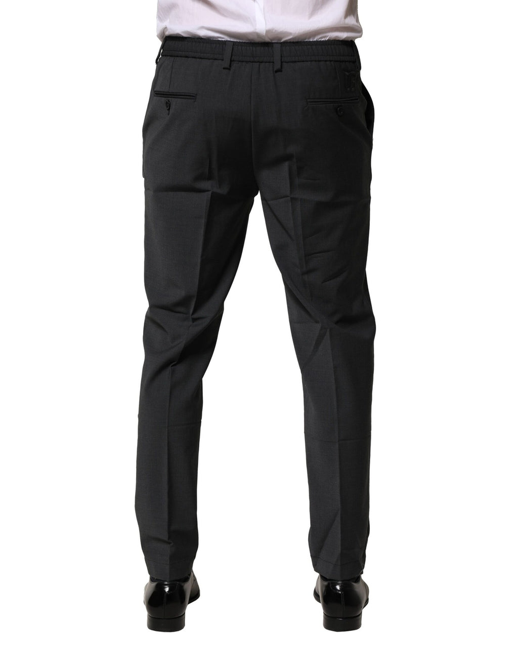 Pantalon formel noir en laine Dolce & Gabbana, coupe slim, élégant et sophistiqué, porté sur un mannequin.
