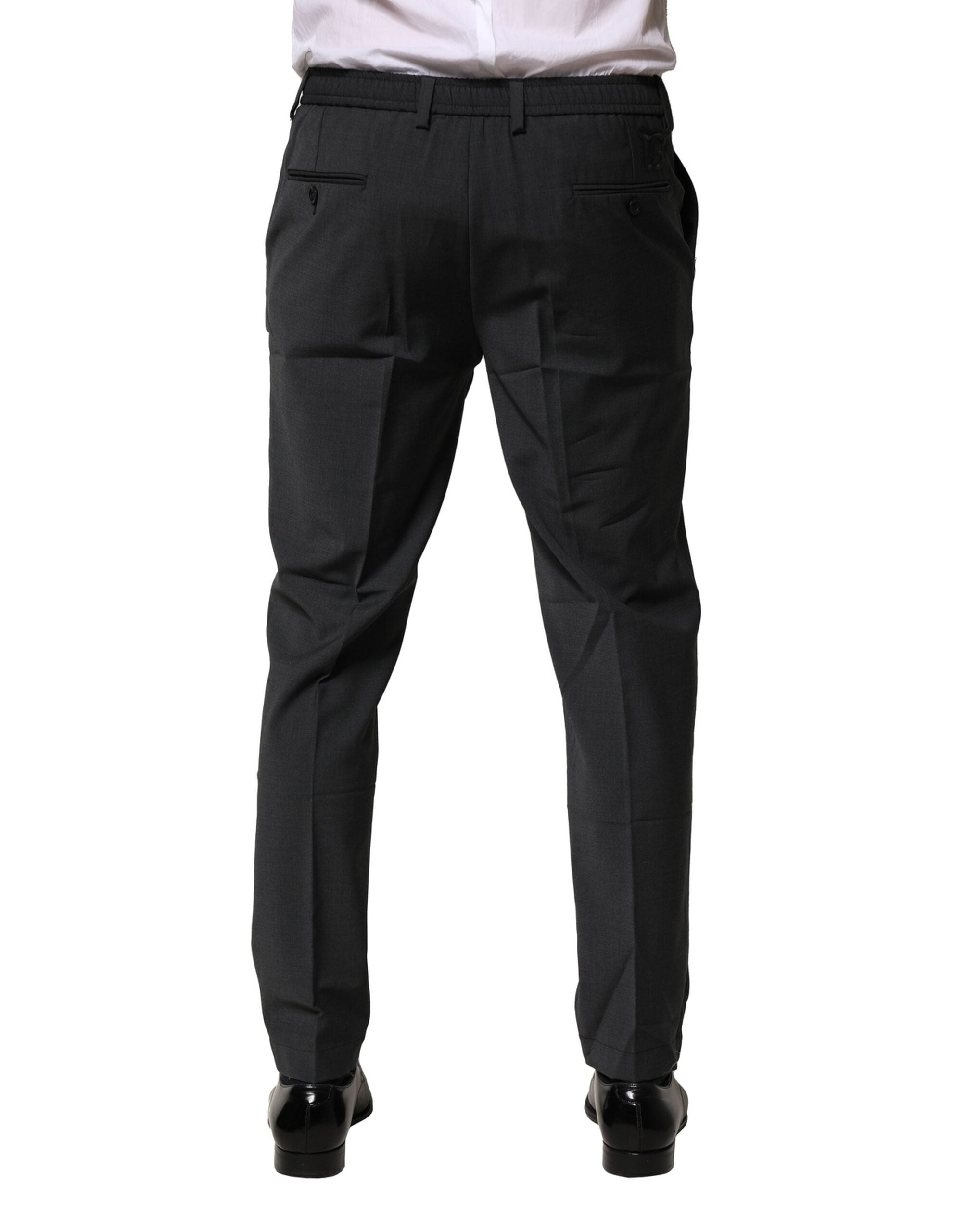 Pantalon formel noir en laine Dolce & Gabbana, coupe slim, élégant et sophistiqué, porté sur un mannequin.