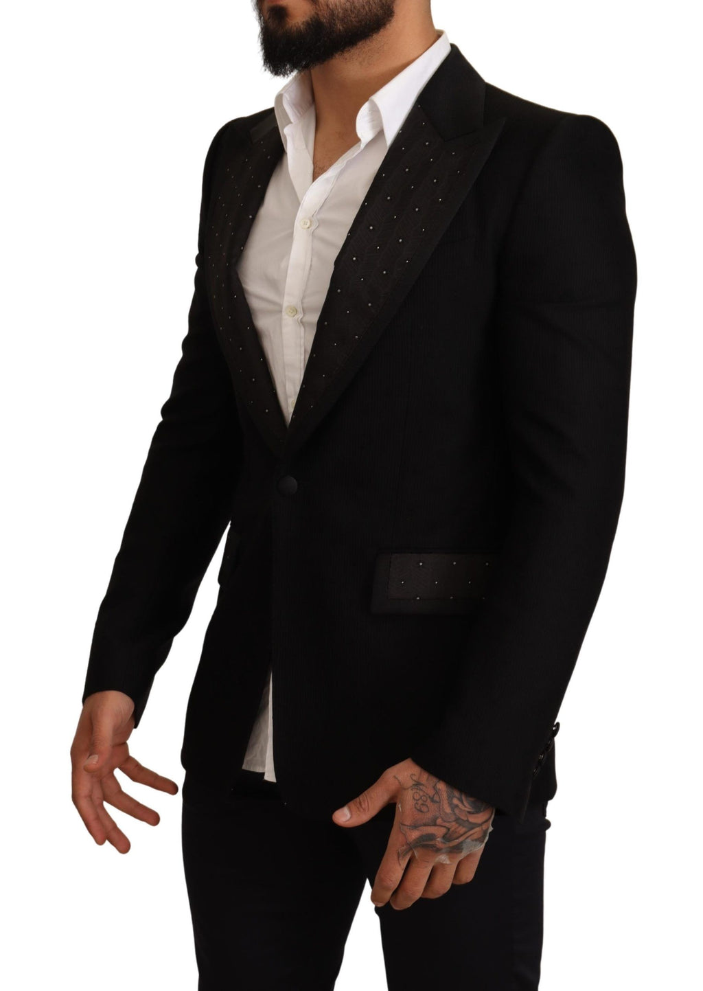 Veste blazer en laine noire Dolce & Gabbana, coupe slim, élégante et sophistiquée, portée sur un fond neutre.