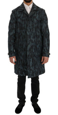 Trench bleu camouflage Dolce & Gabbana pour femme, coupe classique avec ceinture et détails modernes.