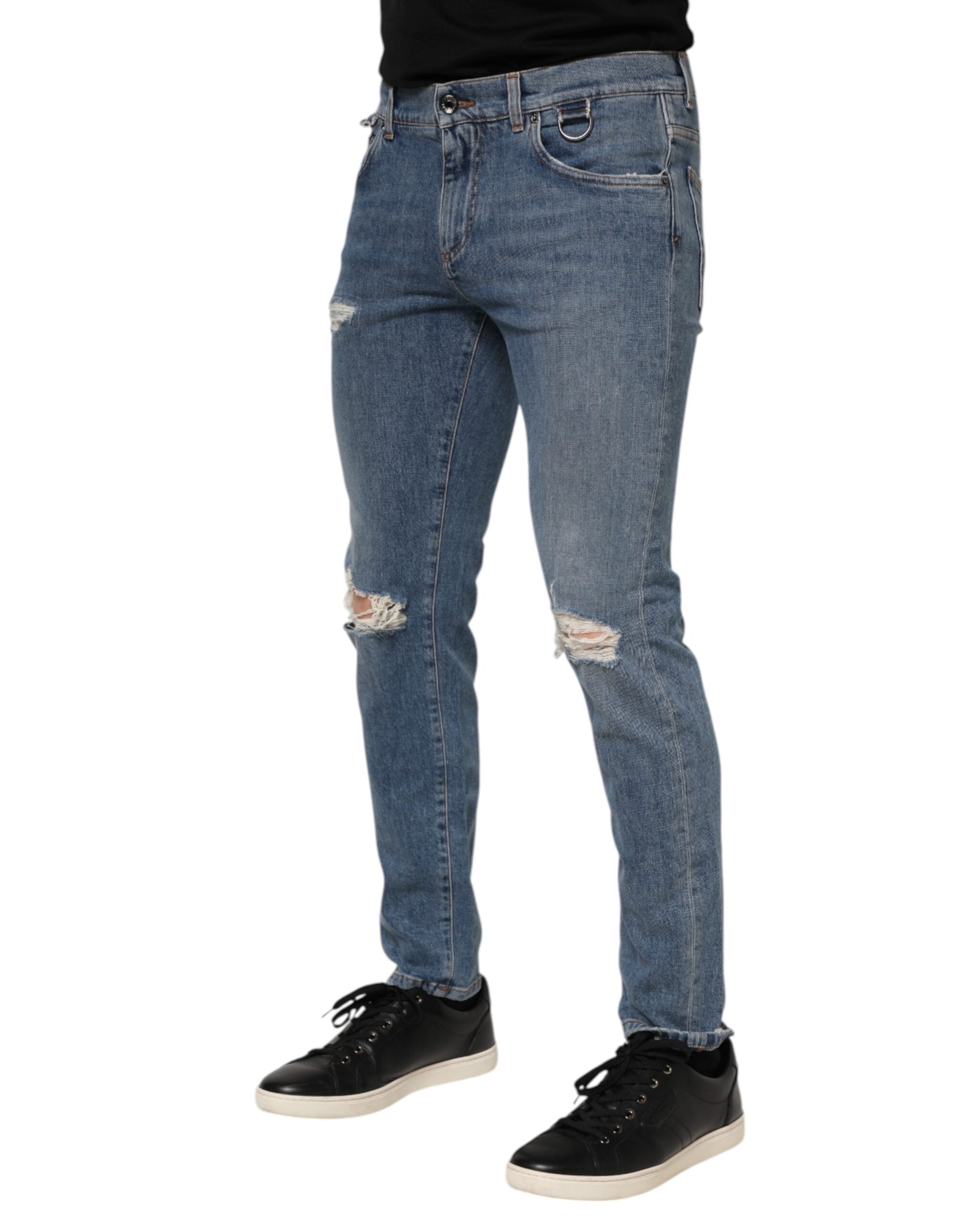 Jeans skinny en denim bleu Dolce & Gabbana avec déchirures, logo visible, en coton, style tattered et ajusté.