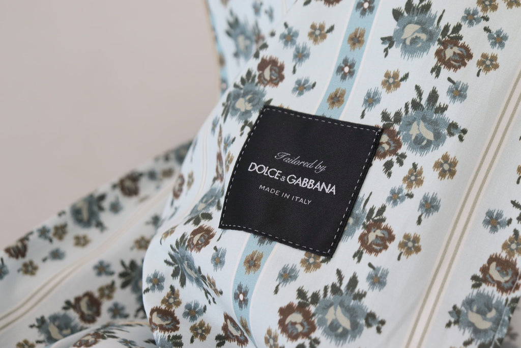 Robe-coat en coton bleu avec motifs floraux Dolce & Gabbana, veste élégante et légère, vue en gros plan.