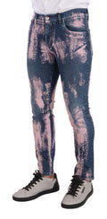 Jeans skinny en denim coton tie-dye bleu et rose de Dolce & Gabbana, style tendance avec motif coloré.