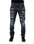Jeans slim en denim coton bleu déchiré de Dolce & Gabbana pour homme, style skinny avec détails usés.