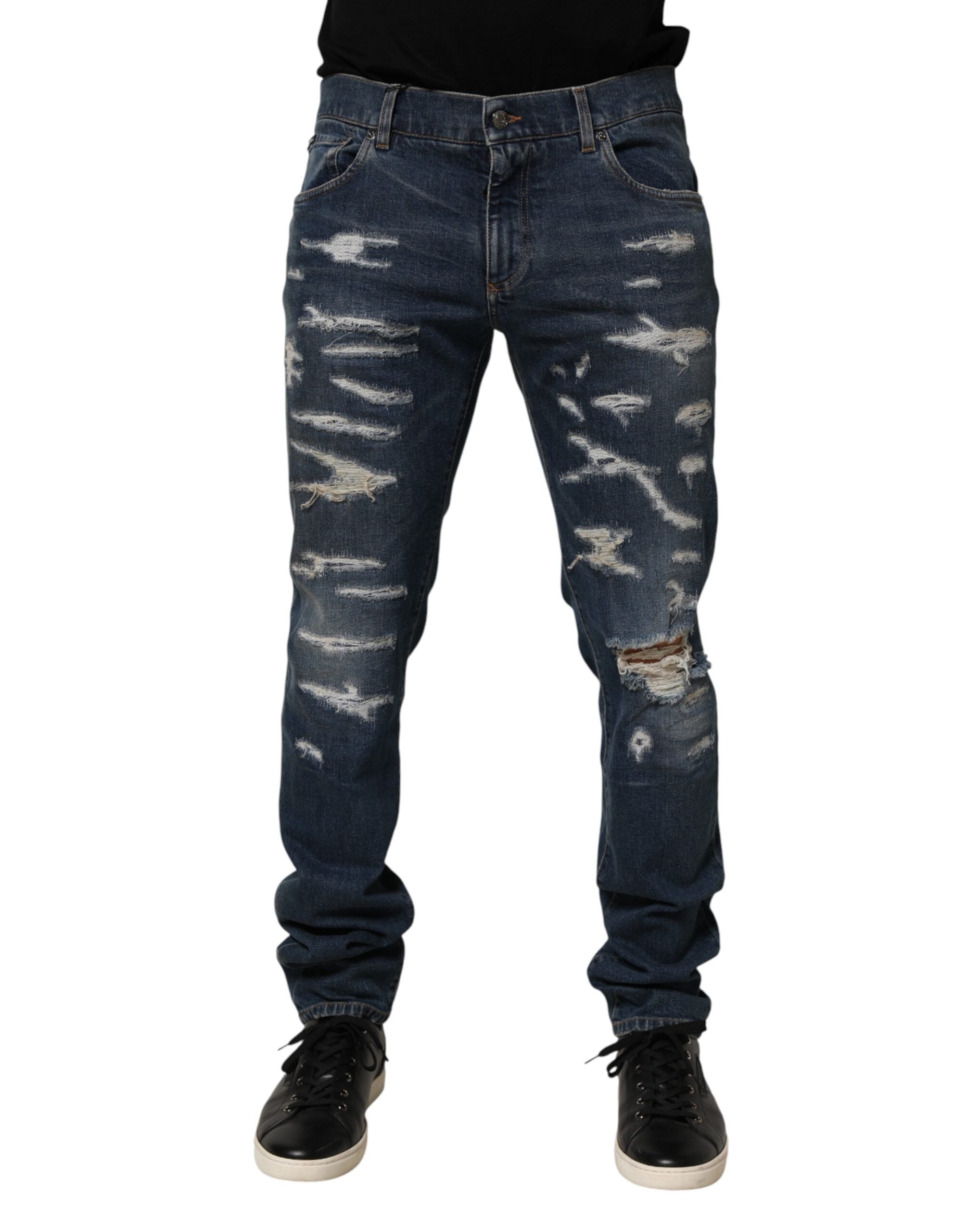 Jeans slim en denim coton bleu déchiré de Dolce & Gabbana pour homme, style skinny avec détails usés.