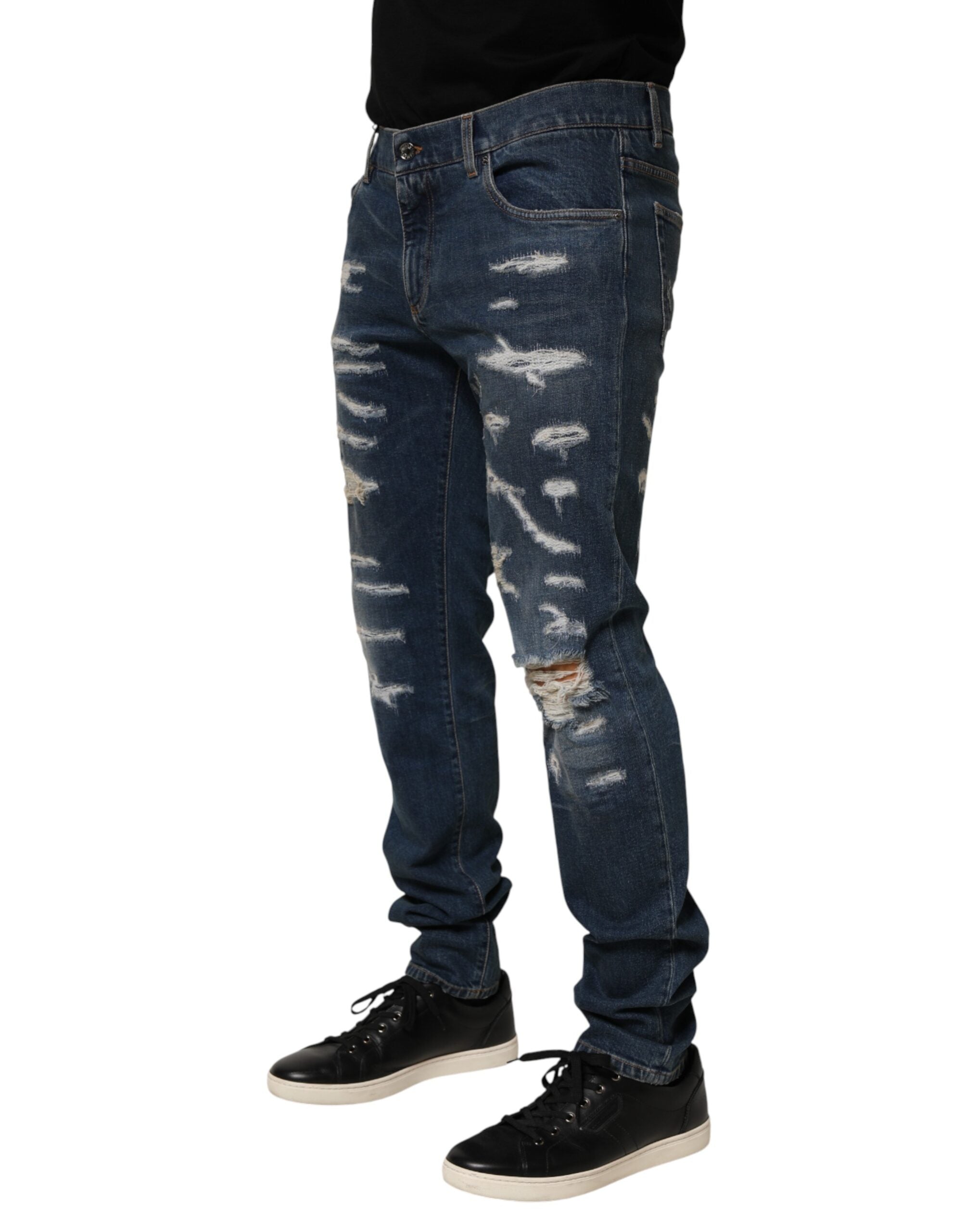Jean homme Dolce & Gabbana en coton bleu déchiré, coupe skinny, style denim, détail usé et moderne.
