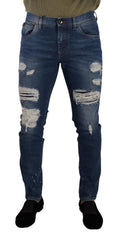 Jeans slim en denim stretch bleu Dolce & Gabbana, coton lavé, ajusté et tendance, visibles sur le modèle.