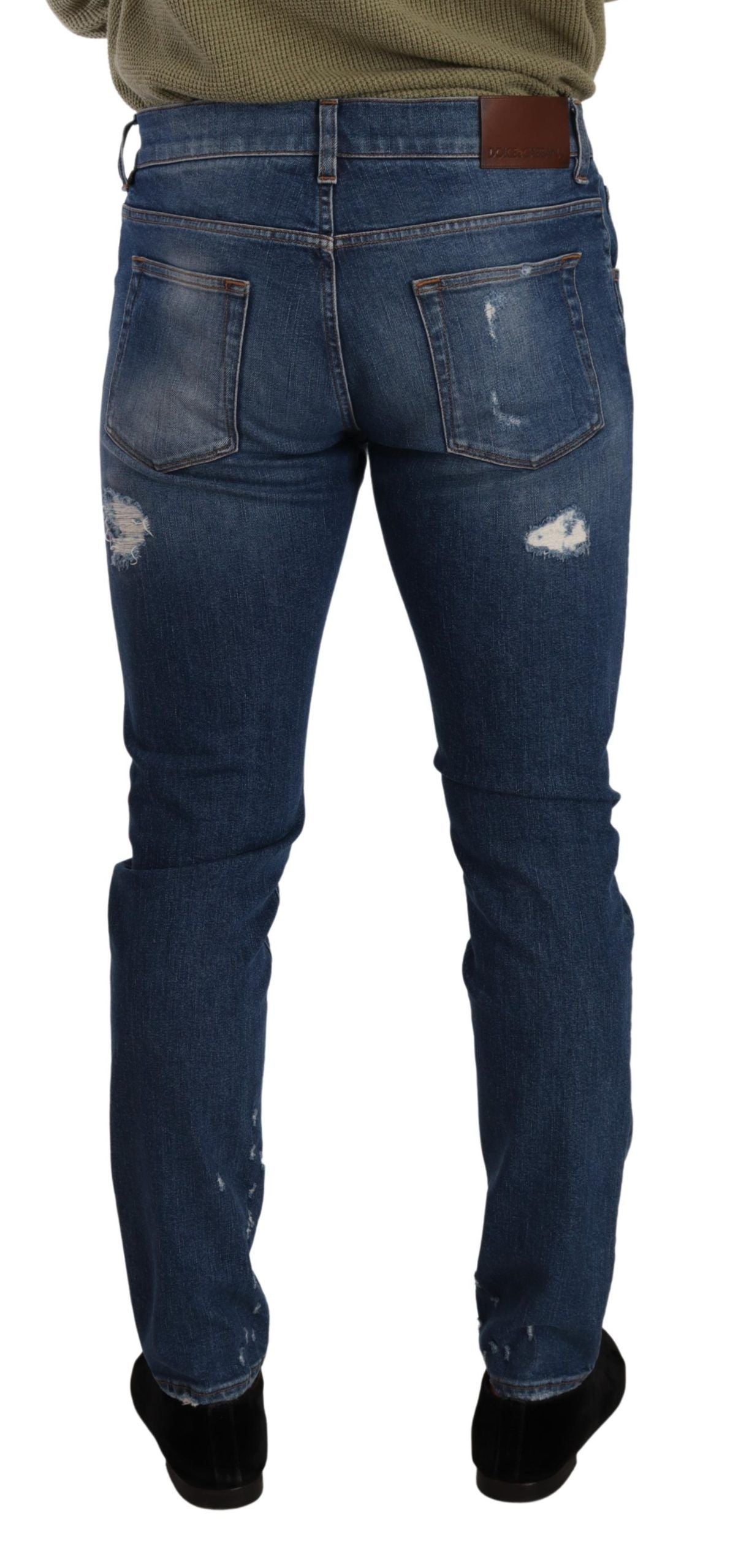 Jeans slim en denim stretch bleu Dolce & Gabbana, coupe ajustée en coton avec lavage bleu.