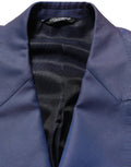 Blazer homme en laine bleue à double boutonnage Dolce & Gabbana, veste élégante avec col revers et poches frontales.