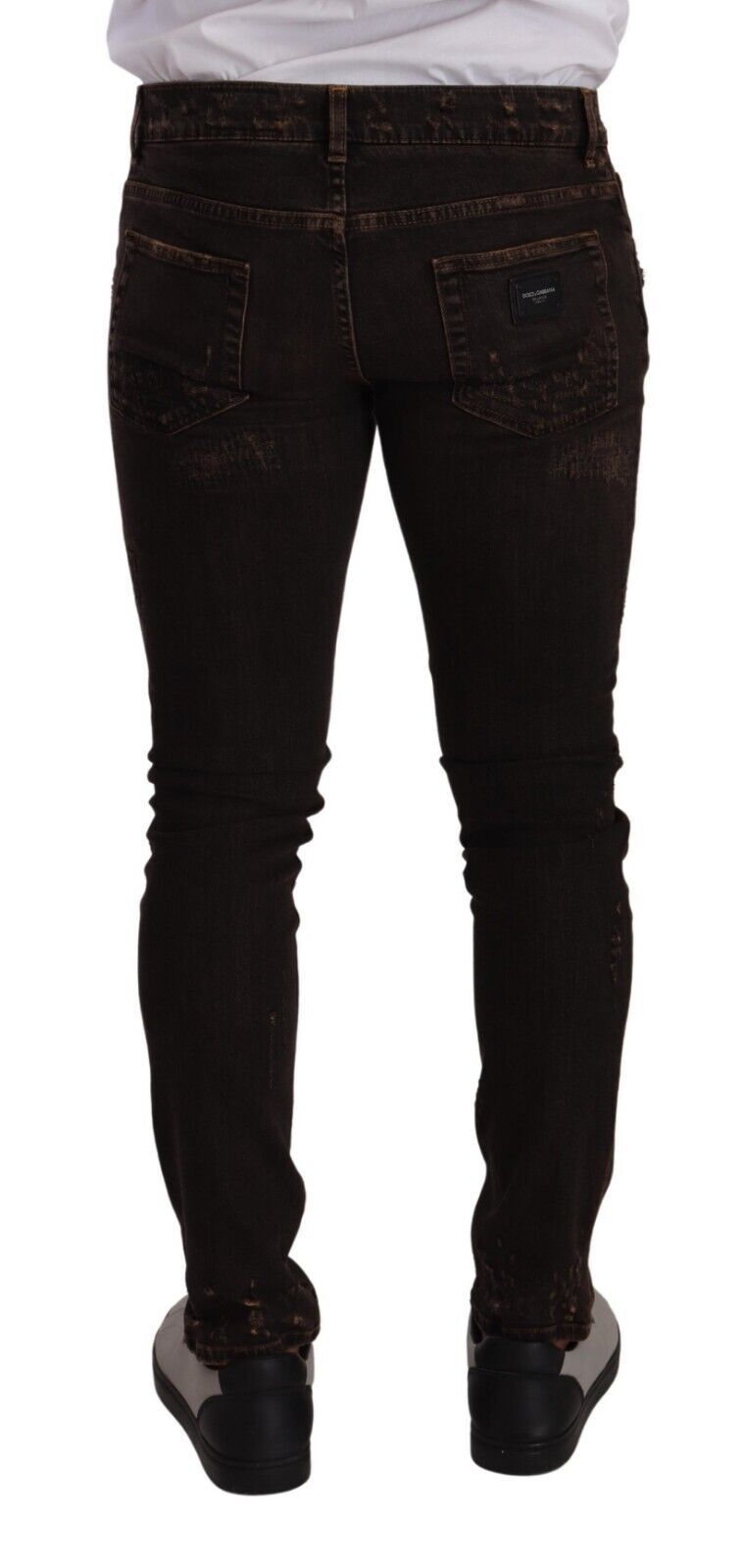 Jeans skinny en denim marron distressed de Dolce & Gabbana, coupe slim et ajustée, visibles avec détails usés et finition tendance.