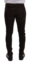 Jeans skinny en denim marron distressed de Dolce & Gabbana, coupe slim et ajustée, visibles avec détails usés et finition tendance.