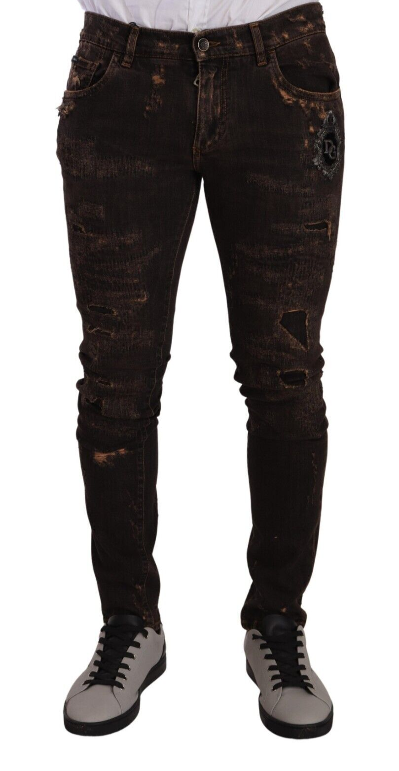 Jeans skinny en denim brun délavé de Dolce & Gabbana, coupe ajustée et tendance, visibles avec détails usés.